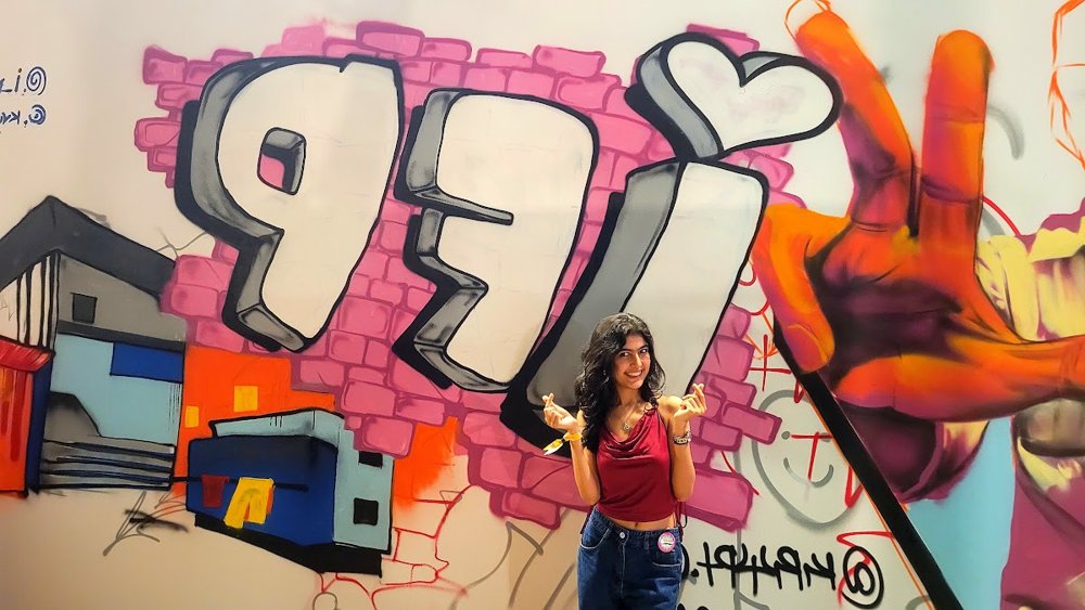 Diya in front of the IFP graffiti wall