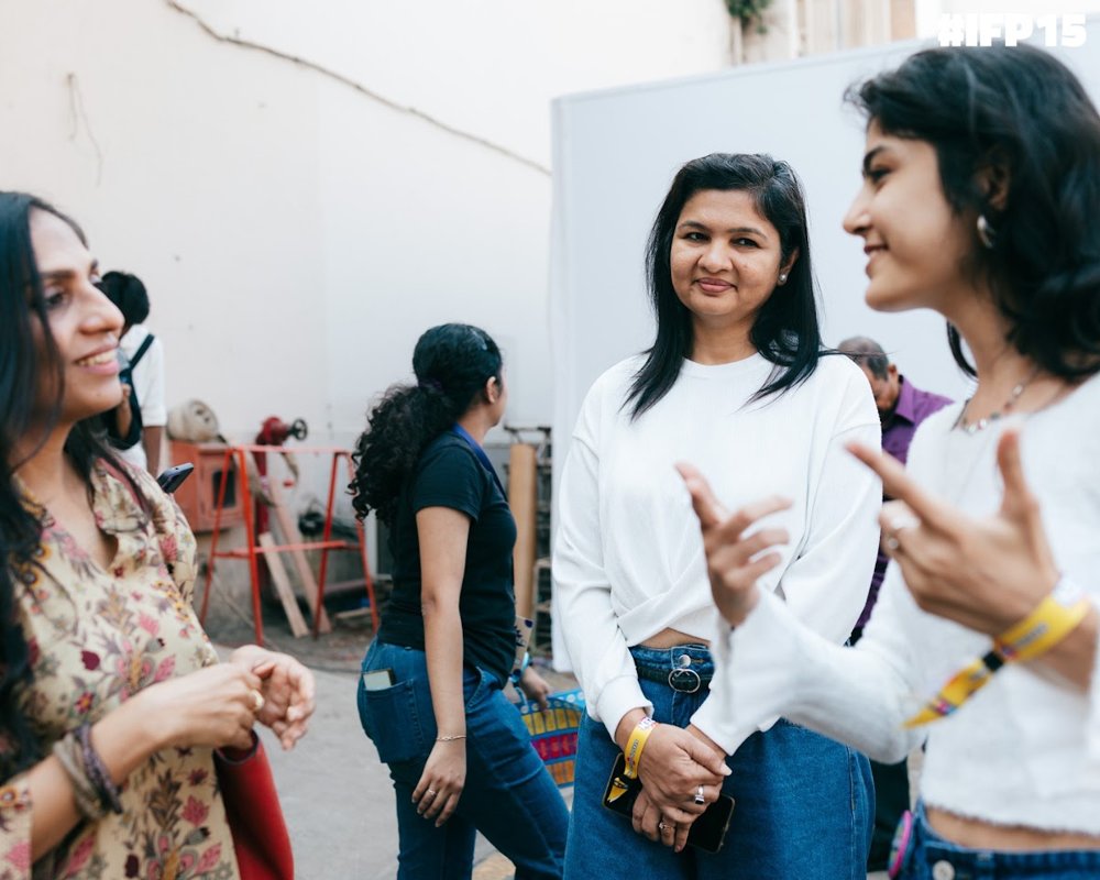 Diya chatting with people at an event
